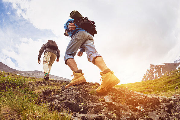 Trekking concept two tourists walking mountains